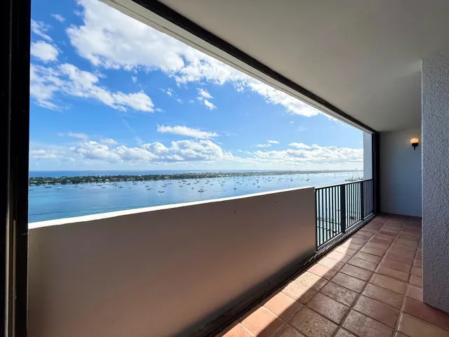 a view of swimming pool with a yard and sitting space