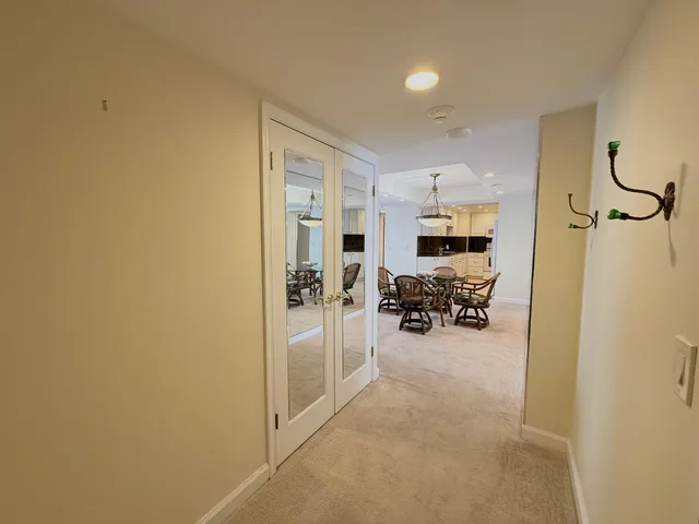 a view of a bathroom from a hallway with toilet