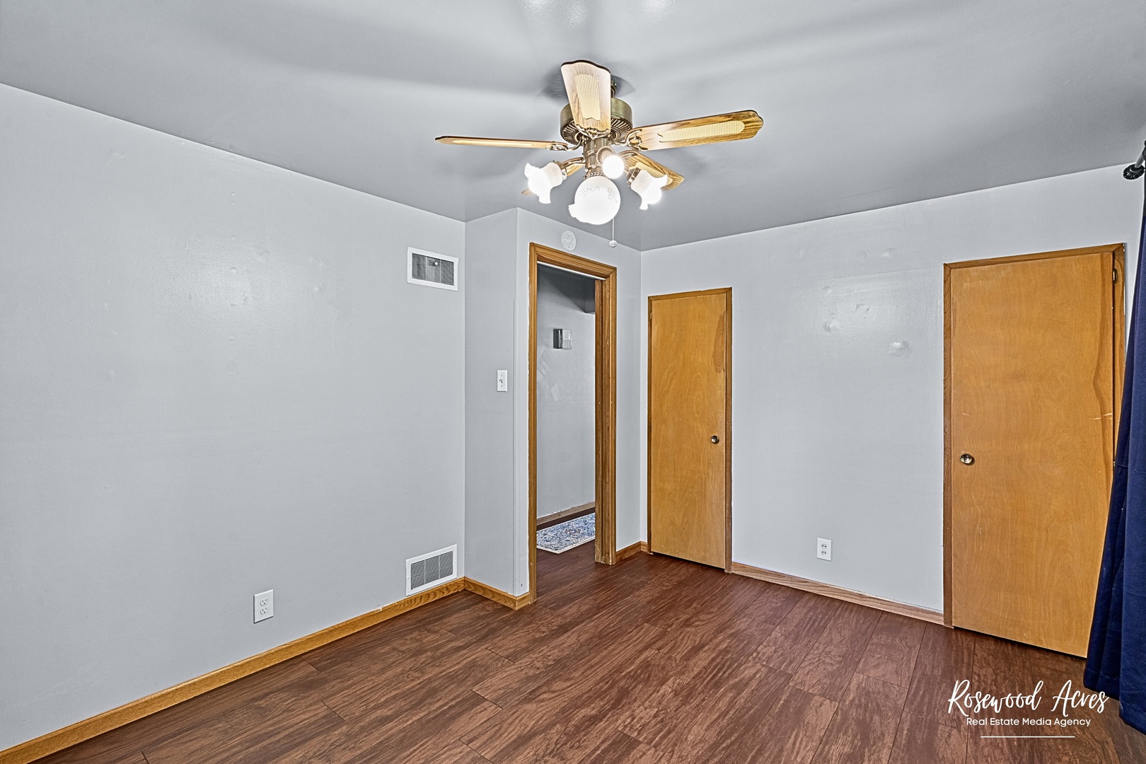 1054 South 7th Avenue Kankakee, IL 60901 - Photo 14 of 30 a view of an empty room with wooden floor and a window
