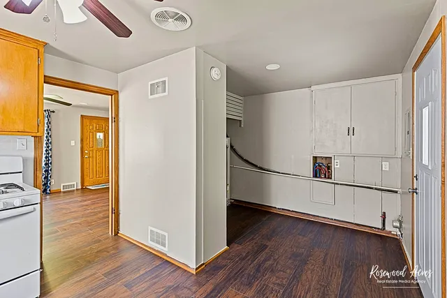 a view of hallway with wooden floor