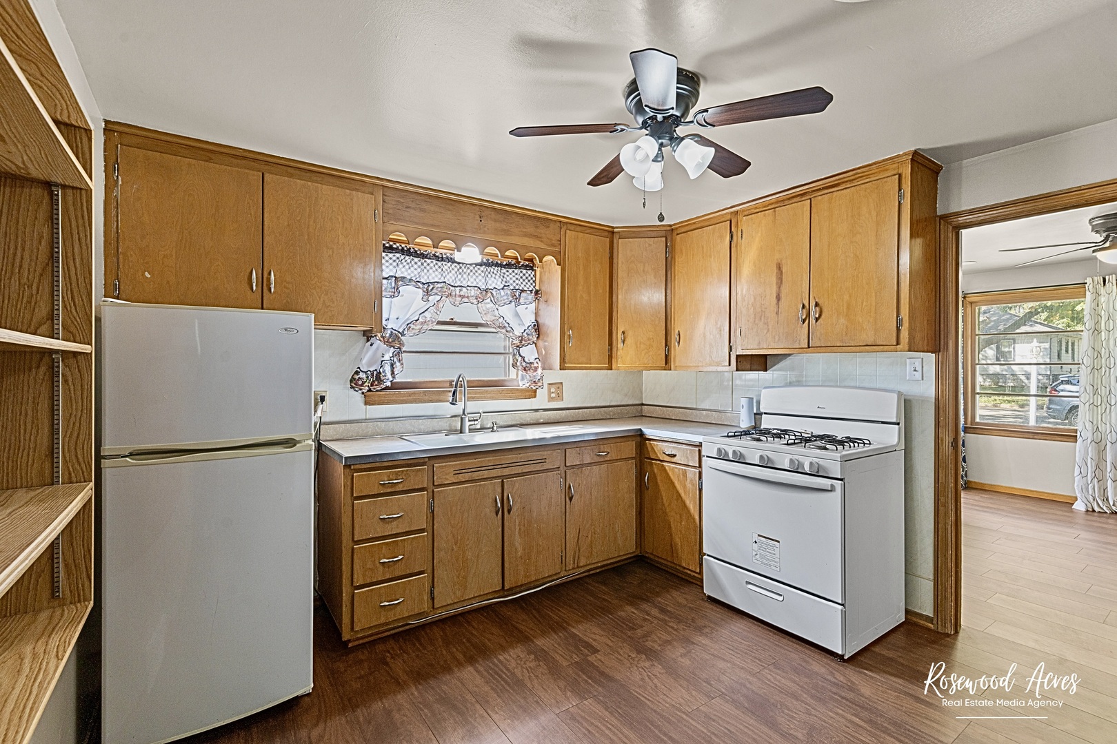 1054 South 7th Avenue Kankakee, IL 60901 - Photo 19 of 30 a kitchen with appliances cabinets and a large window