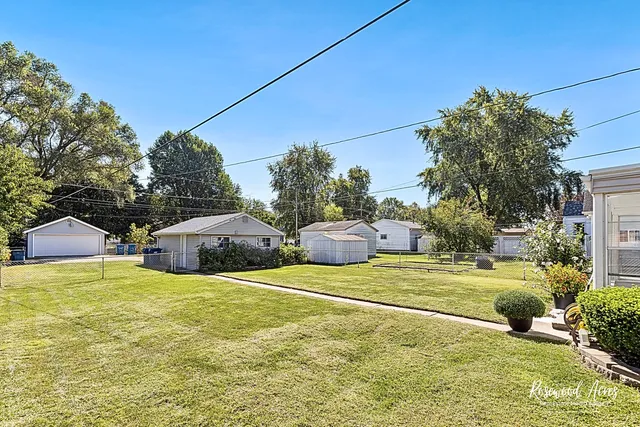 a view of an outdoor space and basketball court