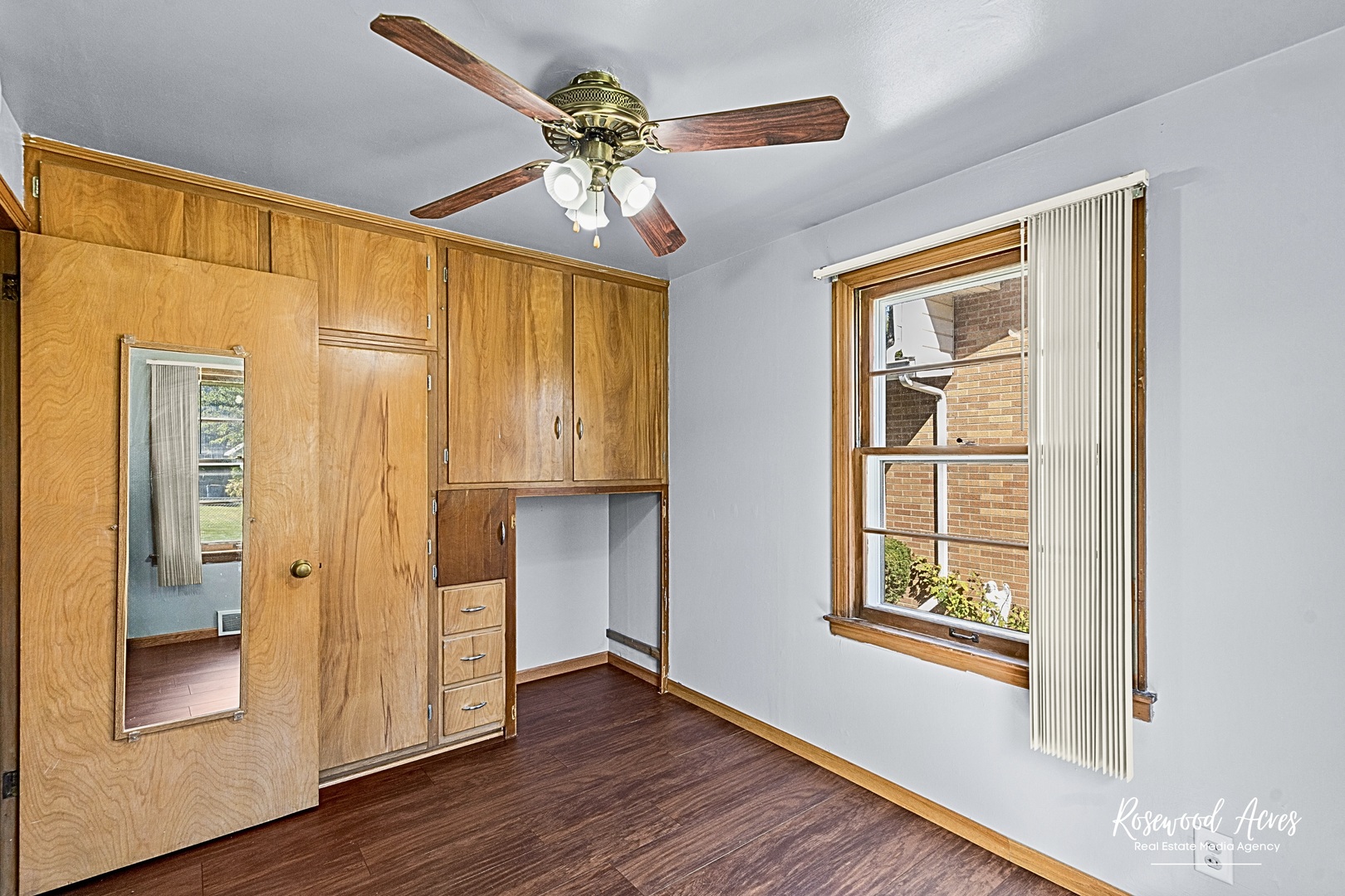 1054 South 7th Avenue Kankakee, IL 60901 - Photo 9 of 30 a view of an entryway with wooden floor and cabinet