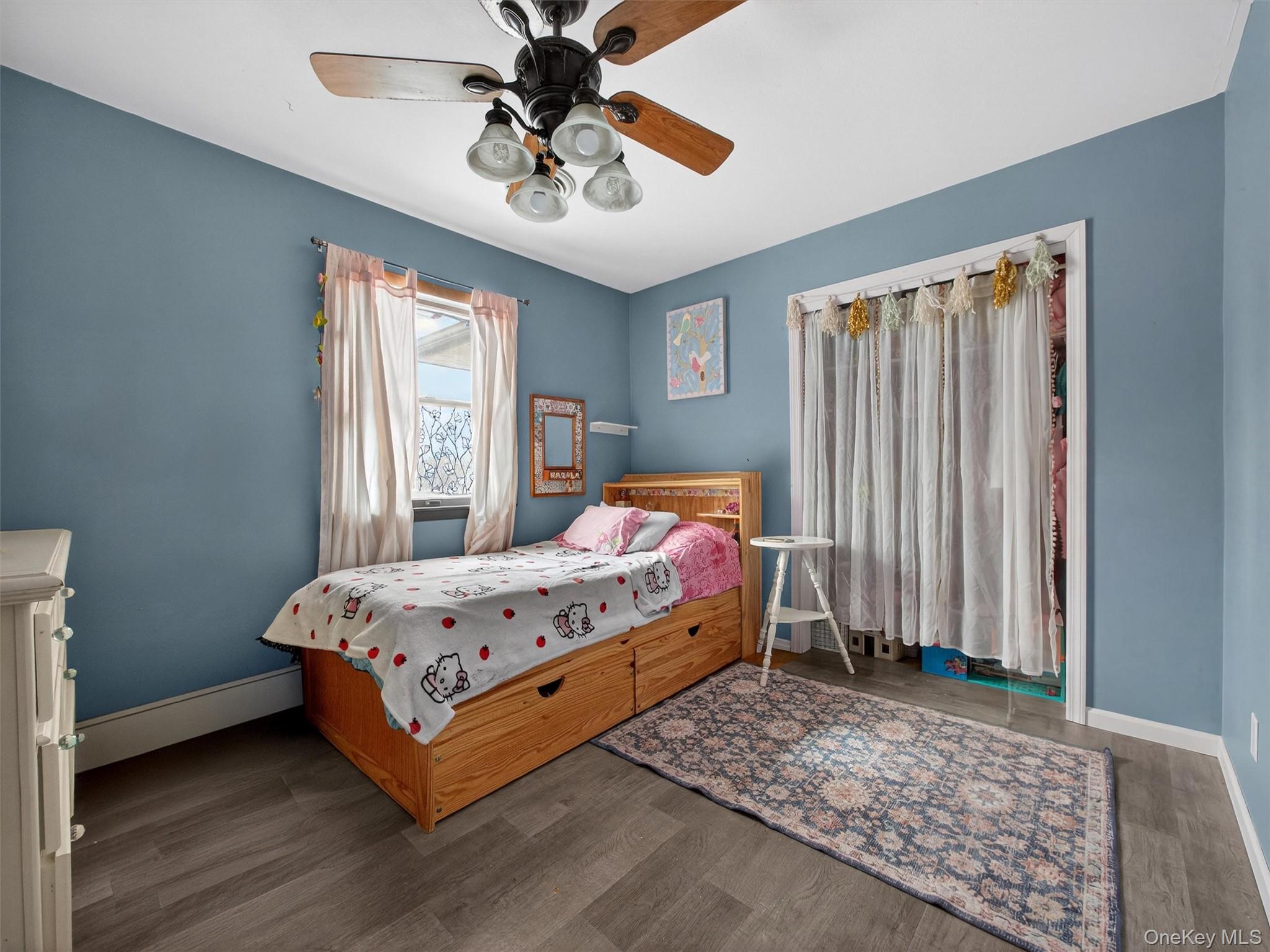 54 Blauvelt Road Blauvelt, NY 10913 - Photo 22 of 41 a bedroom with a bed chandelier and a window