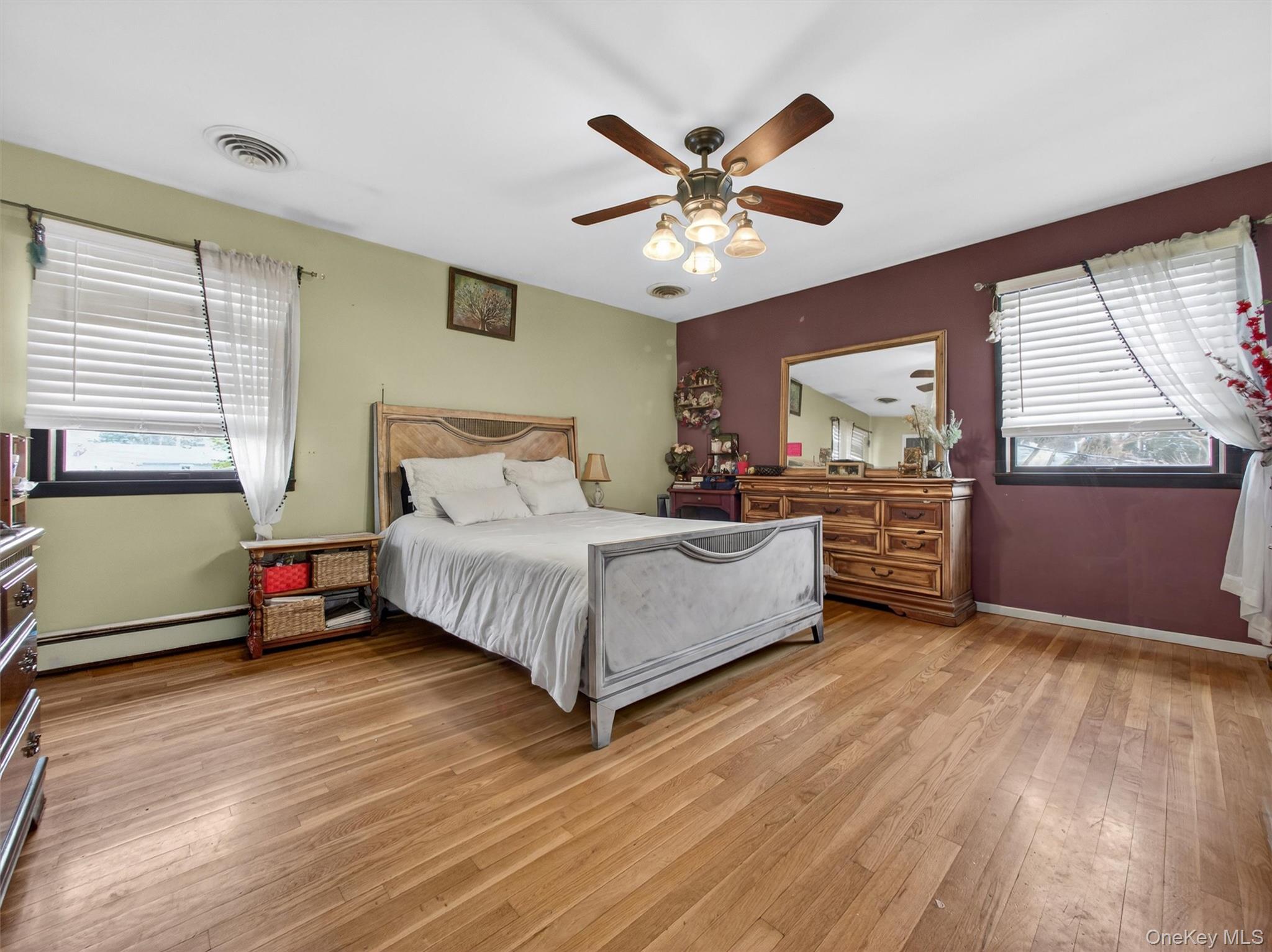 54 Blauvelt Road Blauvelt, NY 10913 - Photo 24 of 41 a bedroom with a large bed and a chandelier