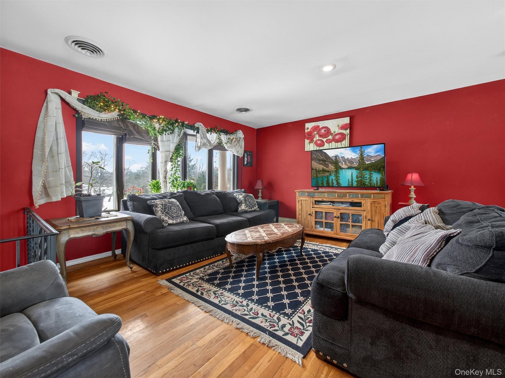 54 Blauvelt Road Blauvelt, NY 10913 - Photo 6 of 41 a living room with furniture a rug and a floor to ceiling window