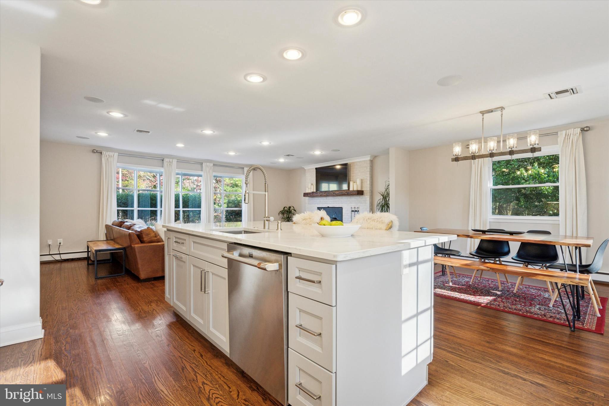 913 Penn Valley Road Media, PA 19063 - Photo 14 of 34 a large kitchen with stainless steel appliances a lot of counter space and a wooden floor