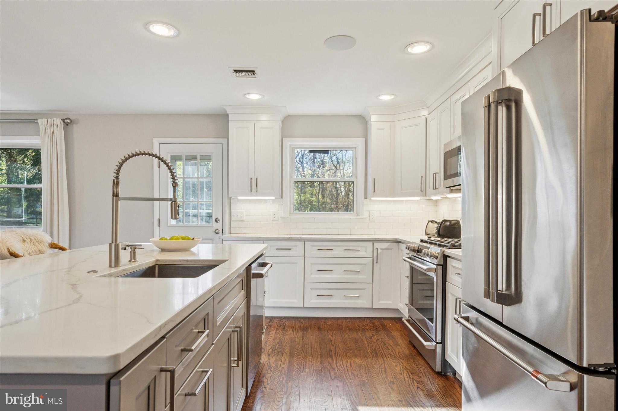 913 Penn Valley Road Media, PA 19063 - Photo 15 of 34 a kitchen with stainless steel appliances granite countertop a refrigerator sink and stove
