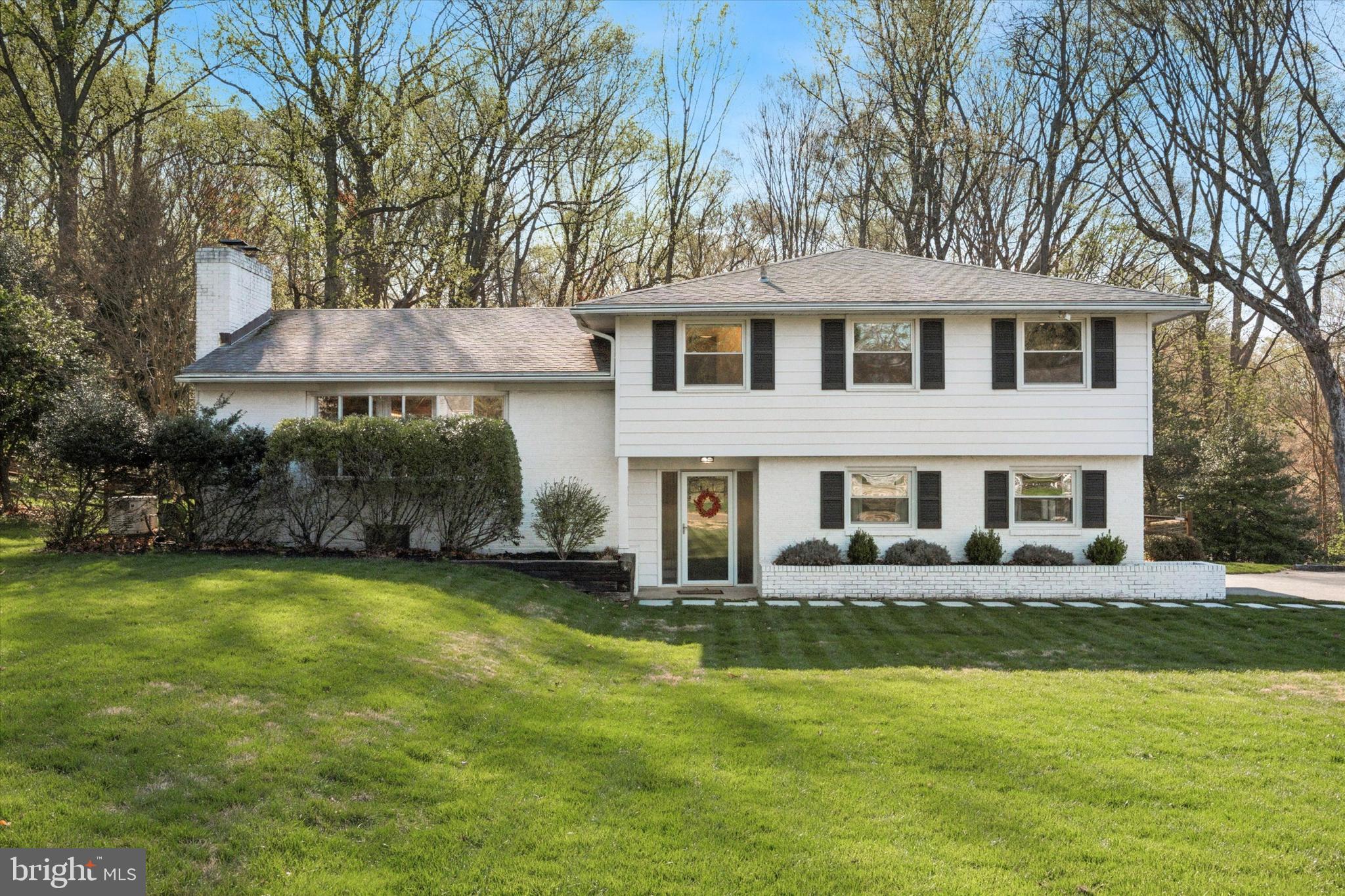 913 Penn Valley Road Media, PA 19063 - Photo 2 of 34 a front view of a house with a yard