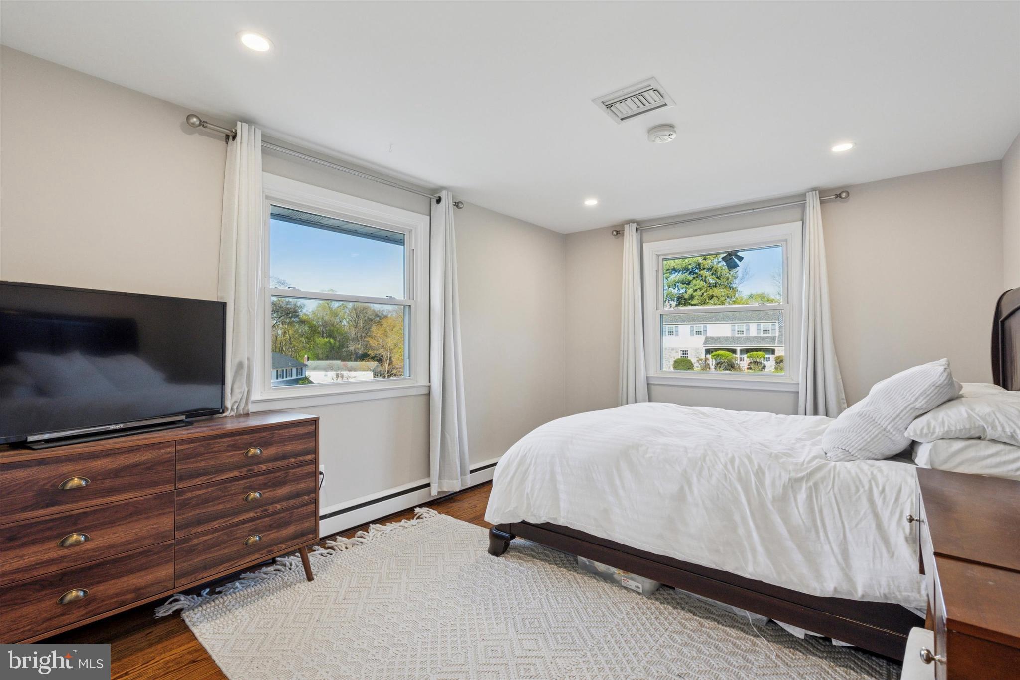 913 Penn Valley Road Media, PA 19063 - Photo 23 of 34 a bedroom with a bed and a flat screen tv