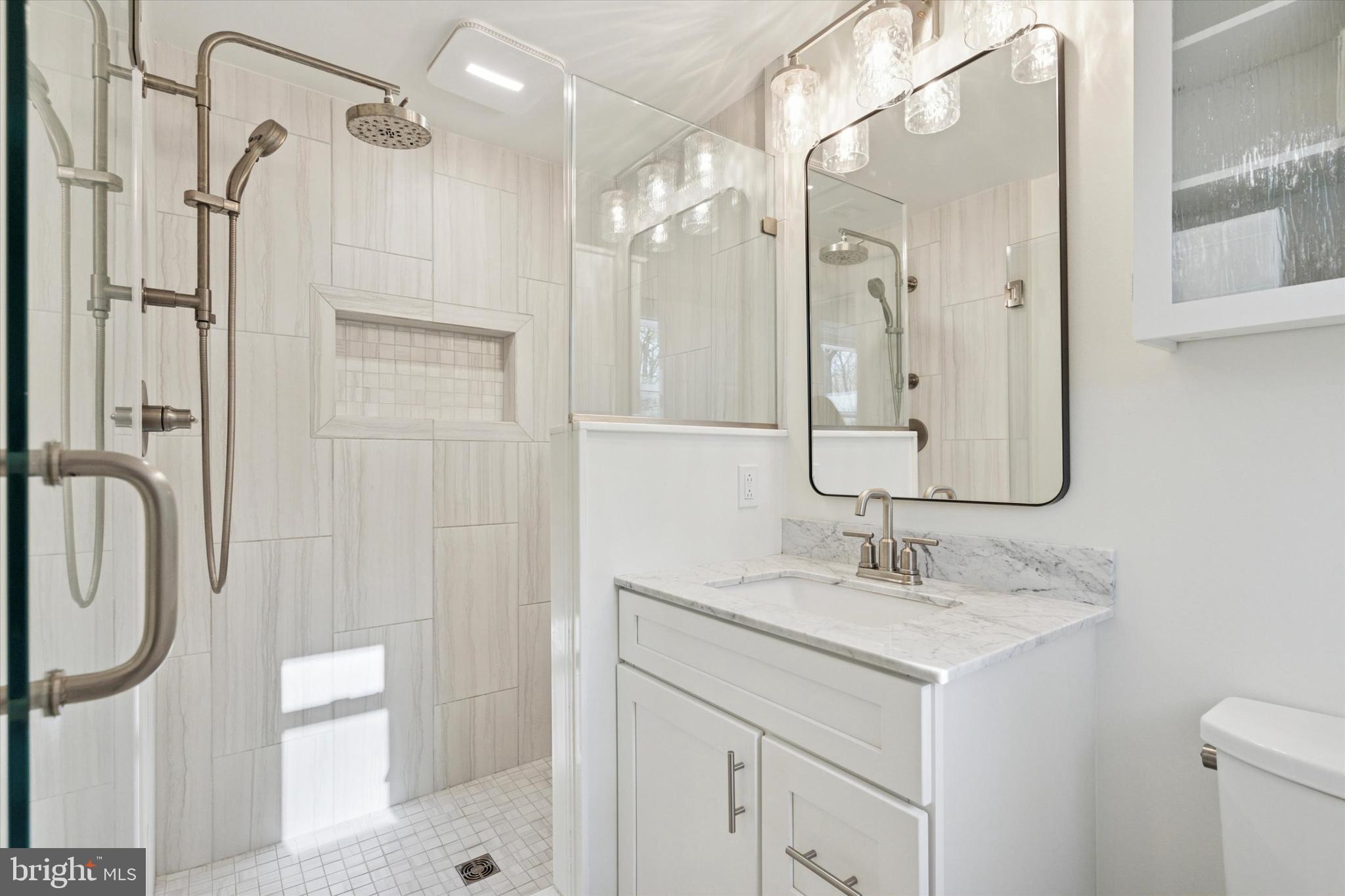 913 Penn Valley Road Media, PA 19063 - Photo 25 of 34 a bathroom with a sink a toilet and shower