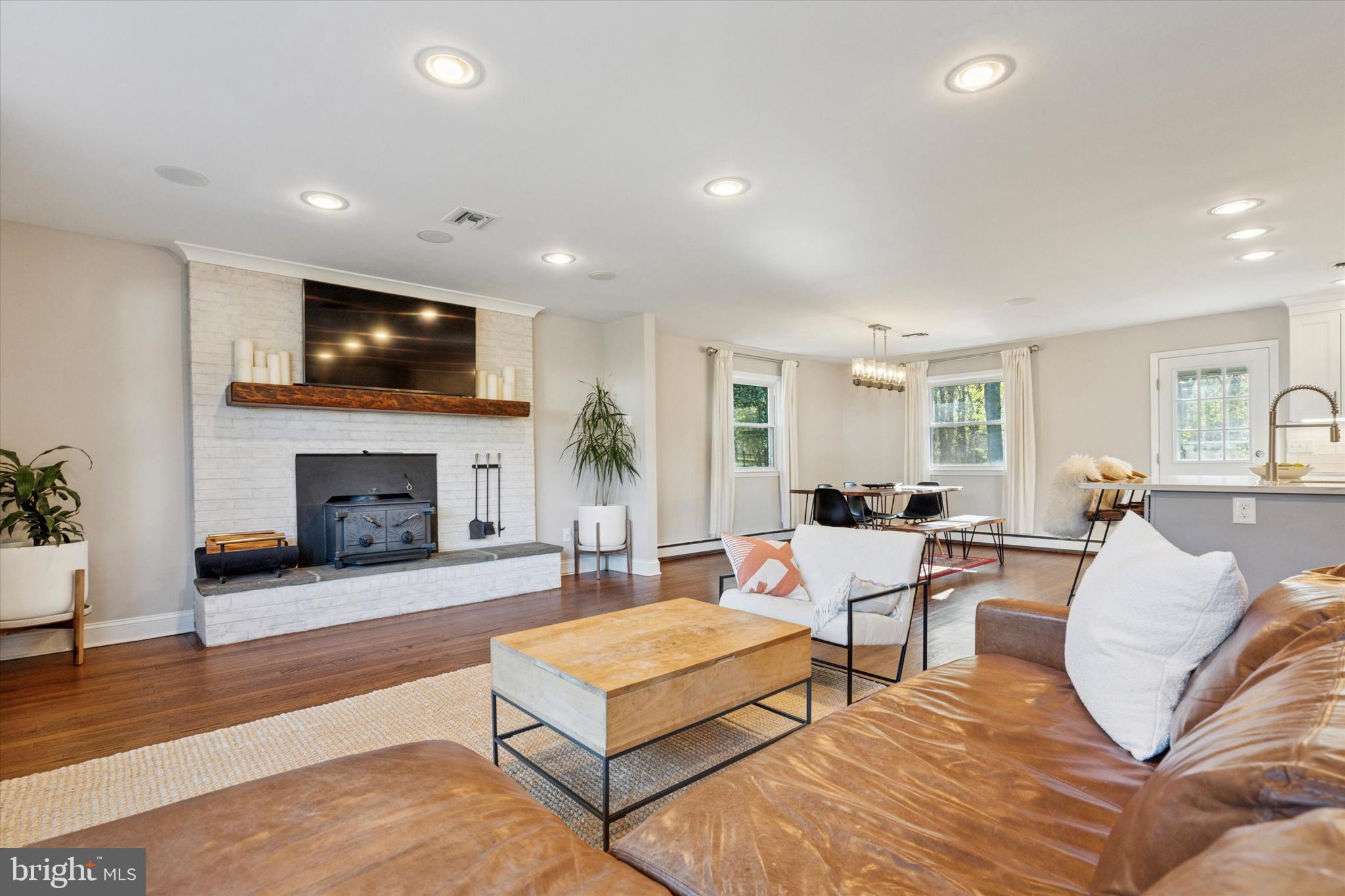 913 Penn Valley Road Media, PA 19063 - Photo 5 of 34 a living room with fireplace furniture and a flat screen tv