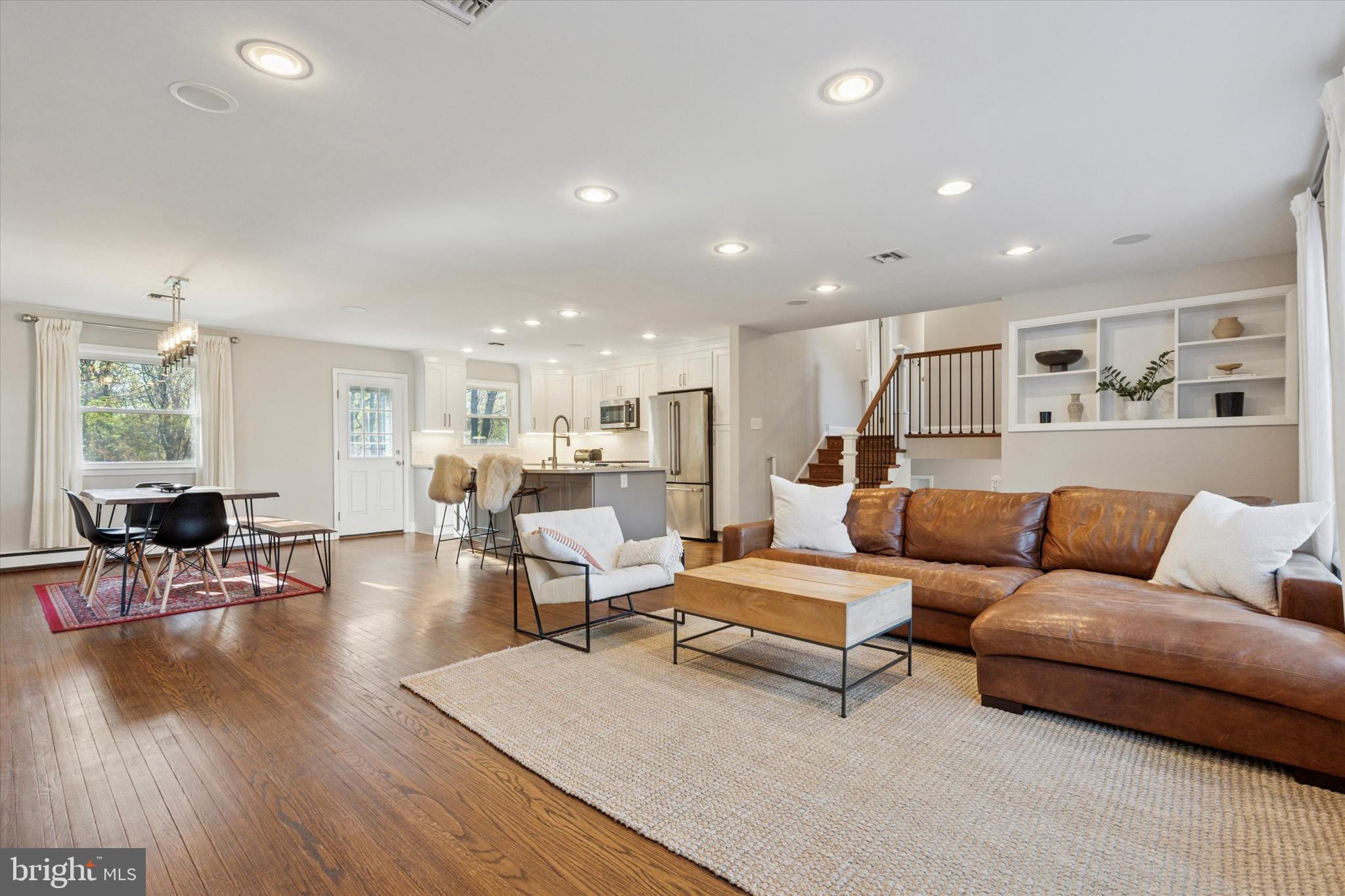 913 Penn Valley Road Media, PA 19063 - Photo 7 of 34 a living room with furniture kitchen view and a wooden floor