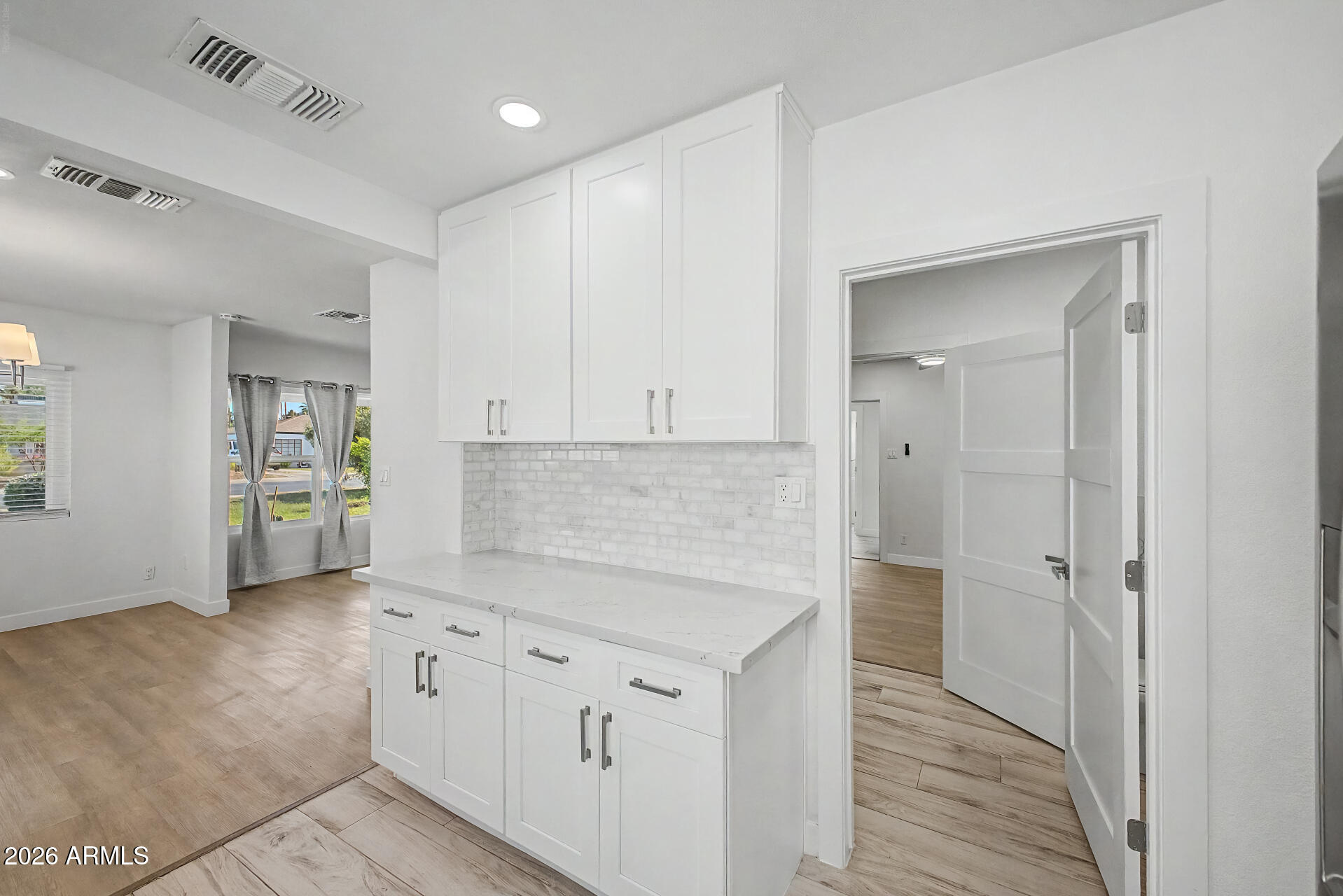 532 East Cheery Lynn Road Phoenix, AZ 85014 - Photo 14 of 37 a view of a kitchen with white cabinets