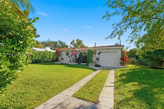 a view of a backyard with a garden