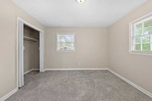 a bathroom with a toilet sink and shower