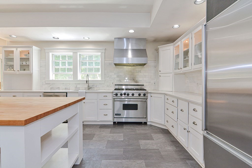 40 Brooks Station Road Princeton, MA 01541 - Photo 12 of 42 a kitchen with white cabinets and appliances