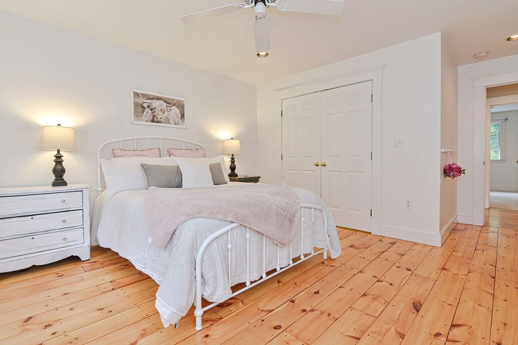 40 Brooks Station Road Princeton, MA 01541 - Photo 20 of 42 a bedroom with a bed and a lamp