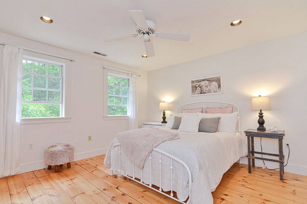 40 Brooks Station Road Princeton, MA 01541 - Photo 21 of 42 a bedroom with a bed and a lamp