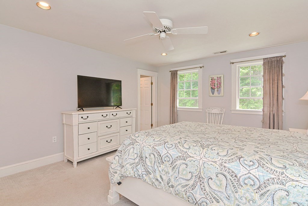 40 Brooks Station Road Princeton, MA 01541 - Photo 28 of 42 a bedroom with a flat screen tv bed and a flat screen tv