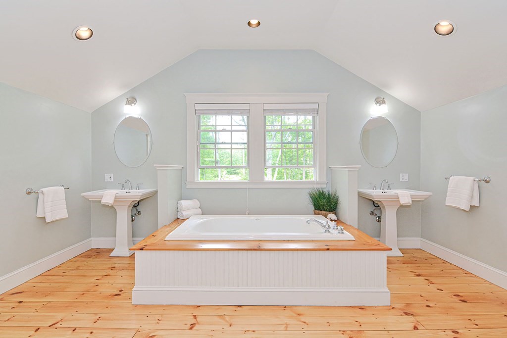 40 Brooks Station Road Princeton, MA 01541 - Photo 33 of 42 a spacious bedroom with a bed mirror and window