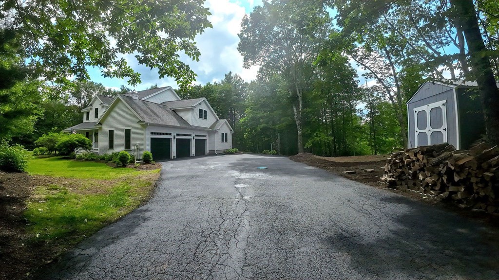 40 Brooks Station Road Princeton, MA 01541 - Photo 42 of 42 a front view of a house with a garden