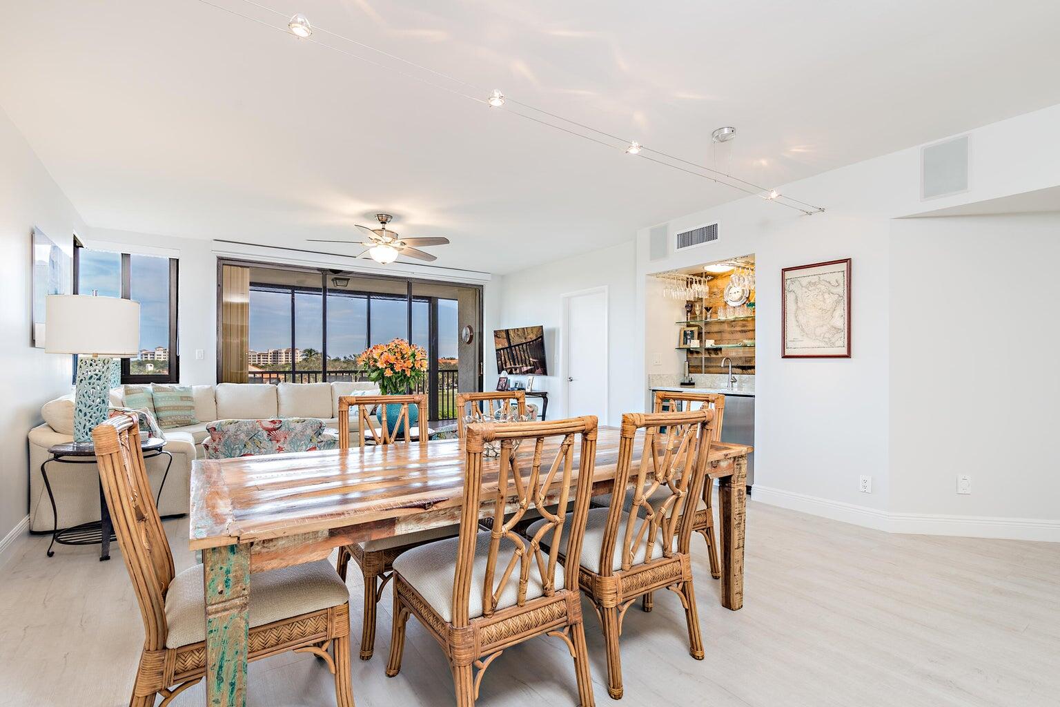 16940 Bay Street, Unit N406 Jupiter, FL 33477 - Photo 2 of 20 a dining room with furniture and window