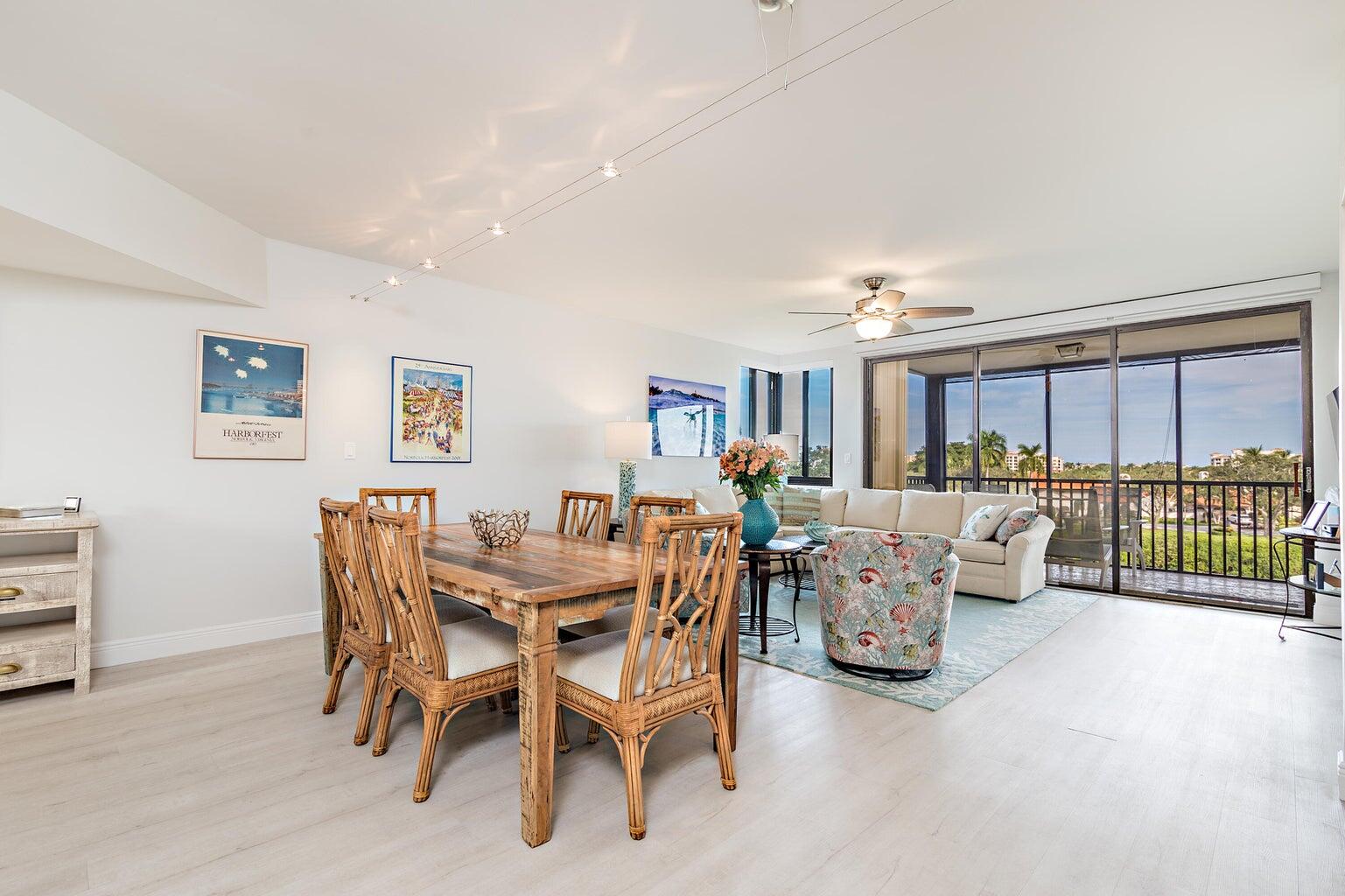 16940 Bay Street, Unit N406 Jupiter, FL 33477 - Photo 3 of 20 a living room with furniture and a large window