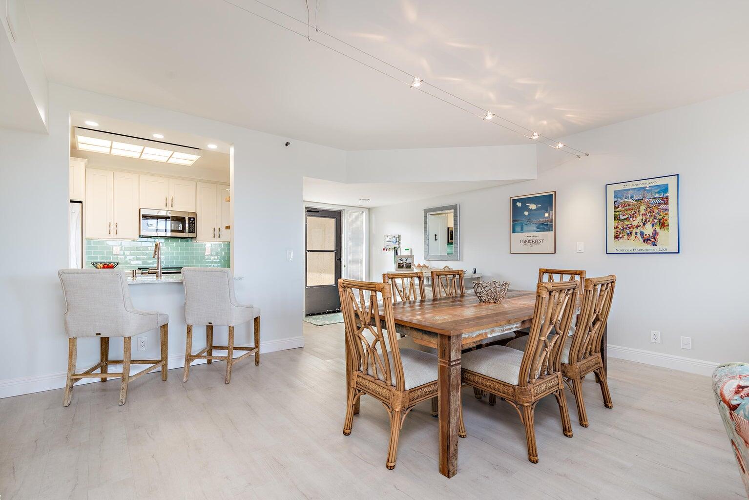 16940 Bay Street, Unit N406 Jupiter, FL 33477 - Photo 6 of 20 a dining room with furniture and window