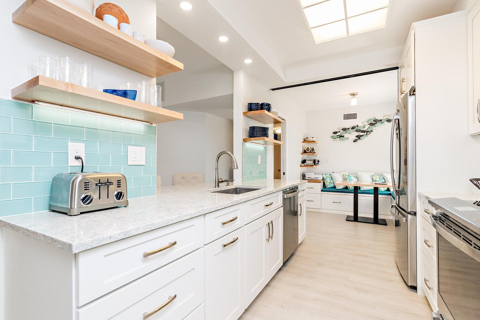 16940 Bay Street, Unit N406 Jupiter, FL 33477 - Photo 8 of 20 a spacious en suite bathroom with a double vanity sink a mirror and a shower