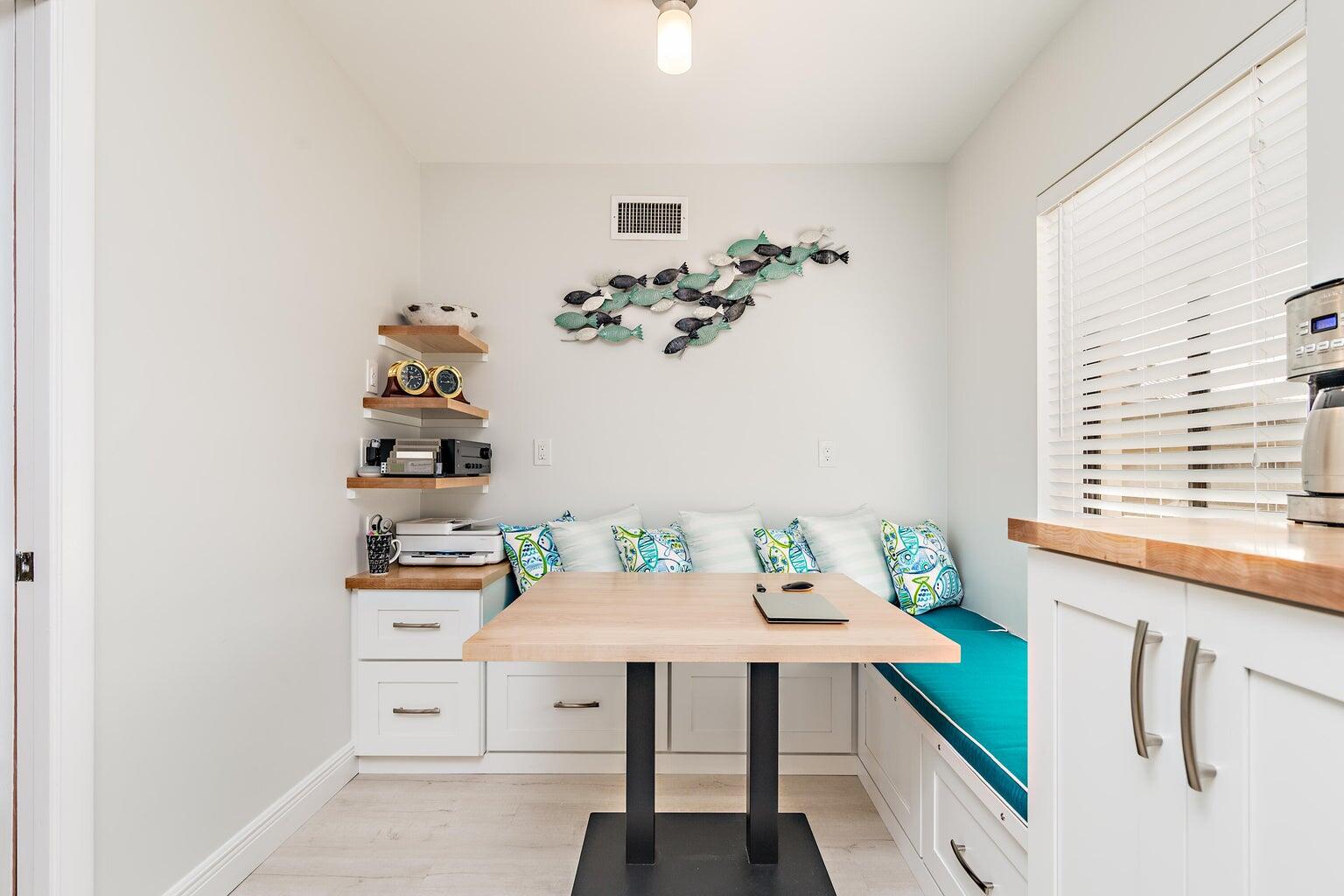 16940 Bay Street, Unit N406 Jupiter, FL 33477 - Photo 10 of 20 a view of a workspace with furniture and window