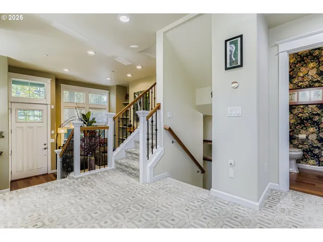 a view of a livingroom with stairs