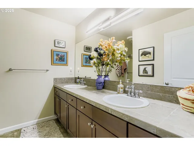a bathroom with a granite countertop sink mirror and vanity