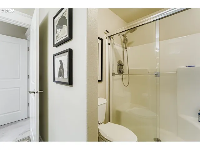 a bathroom with a shower and a sink