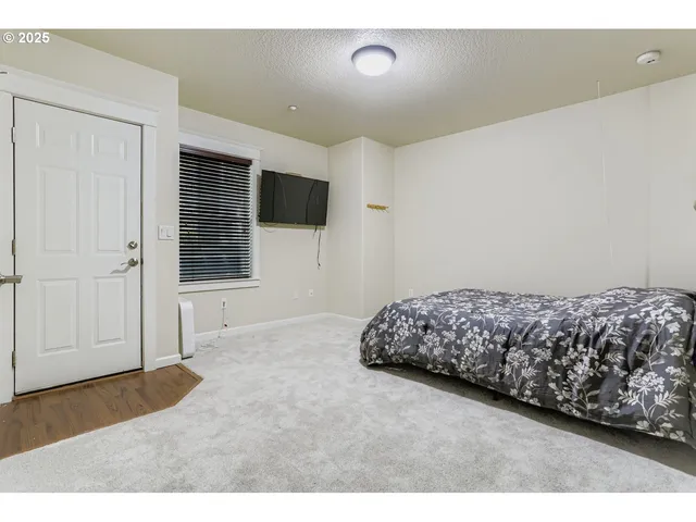 a living room with a couch and a flat screen tv
