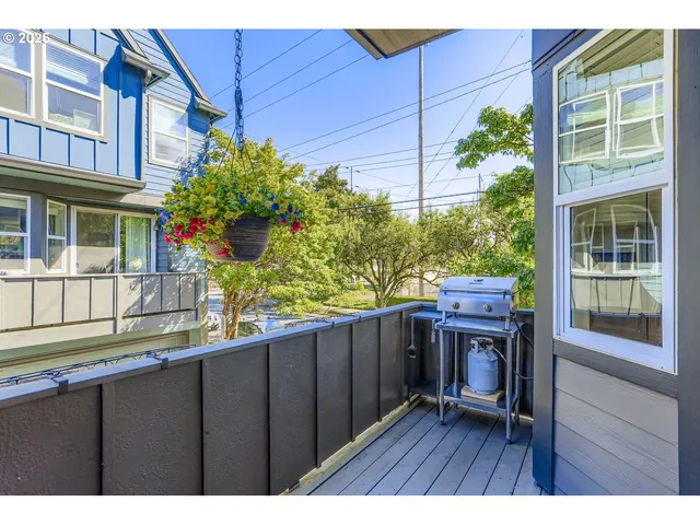 a view of a house with a porch and furniture
