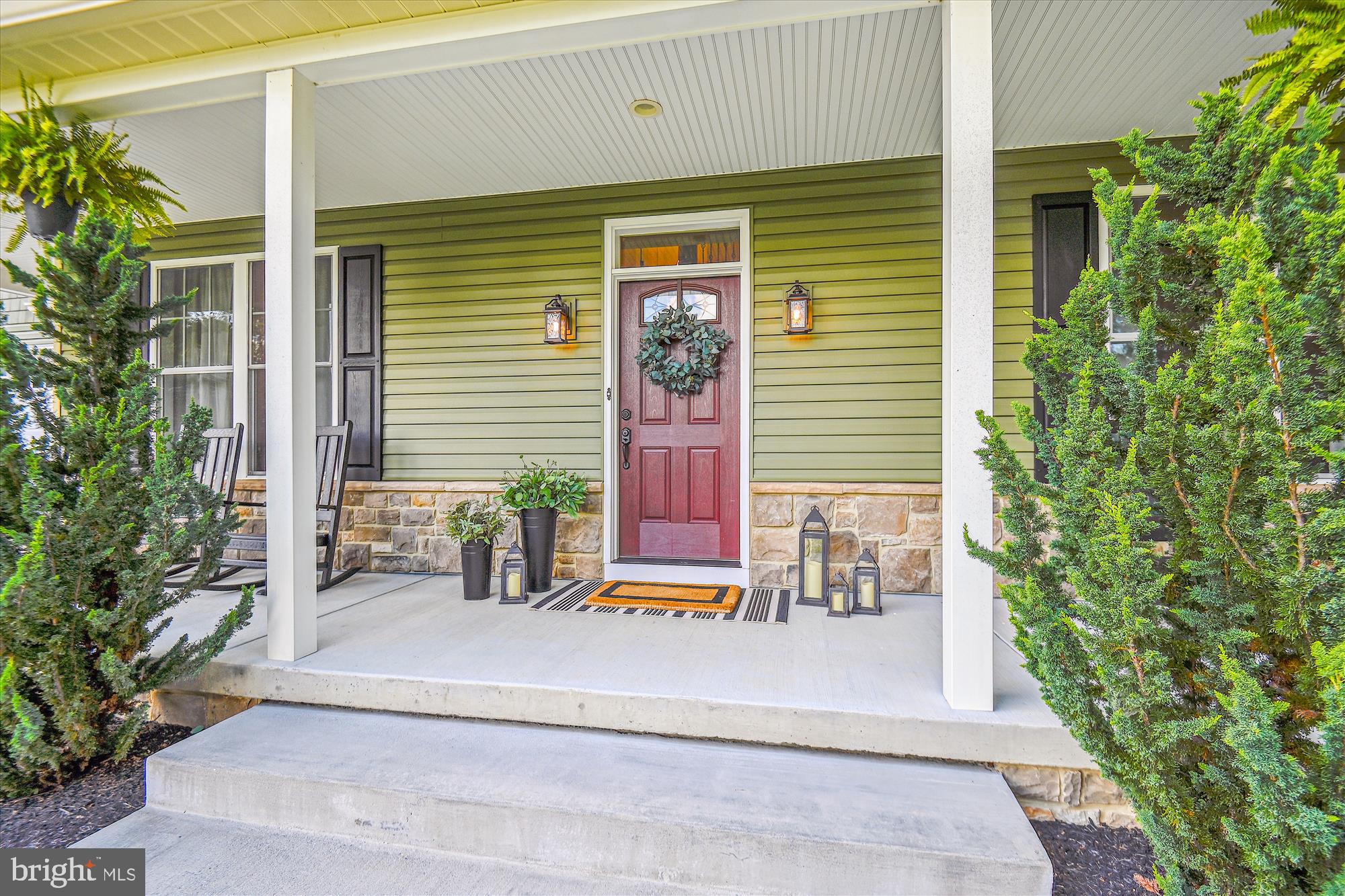 12700 Handboard Road Union Bridge, MD 21791 - Photo 5 of 74 a front view of a house with a plants and chairs