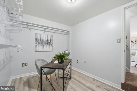 a view of a room that has a table and chair in it