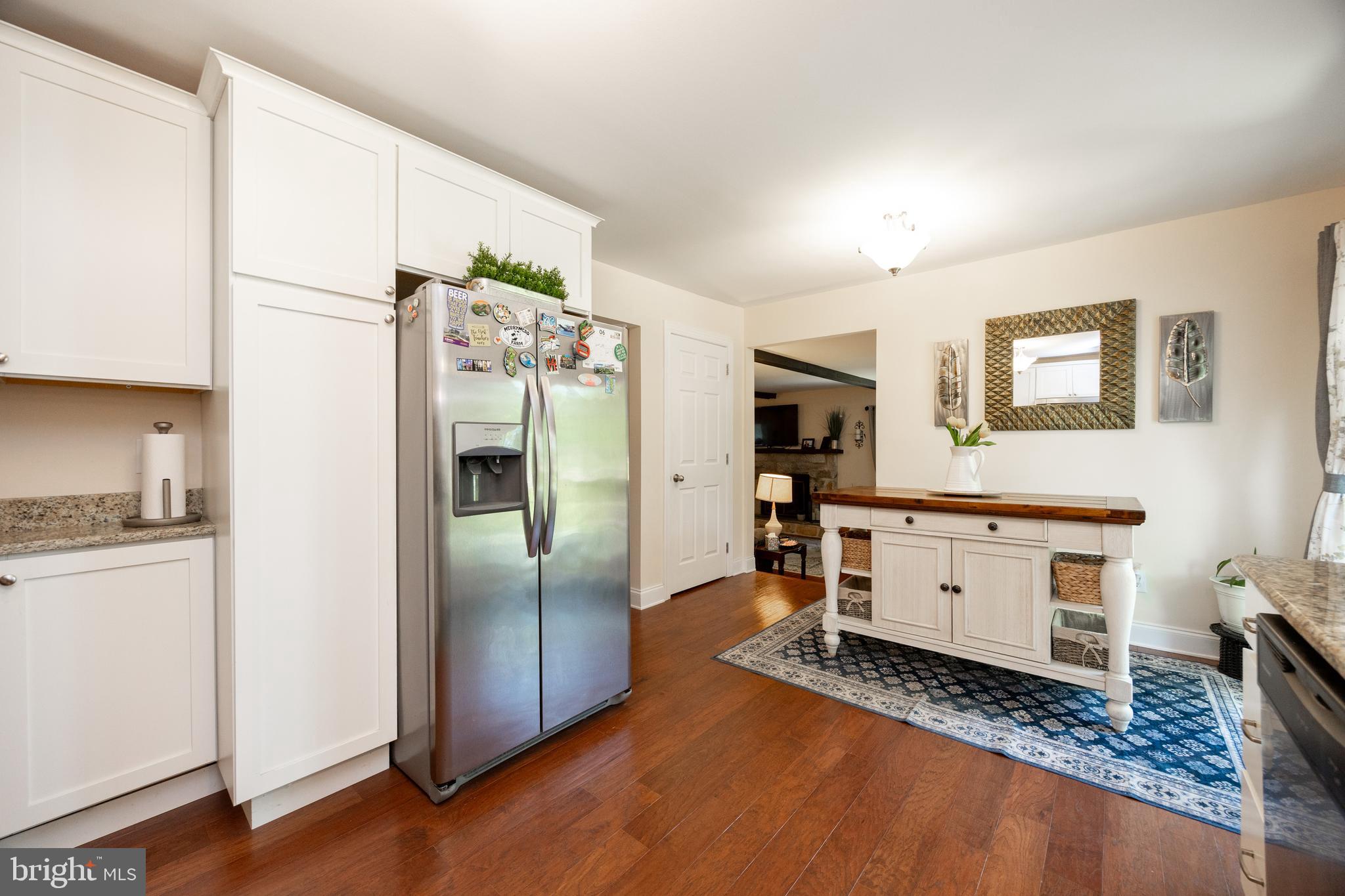 926 Pierce Road Norristown, PA 19403 - Photo 14 of 54 a kitchen with a refrigerator and a stove top oven