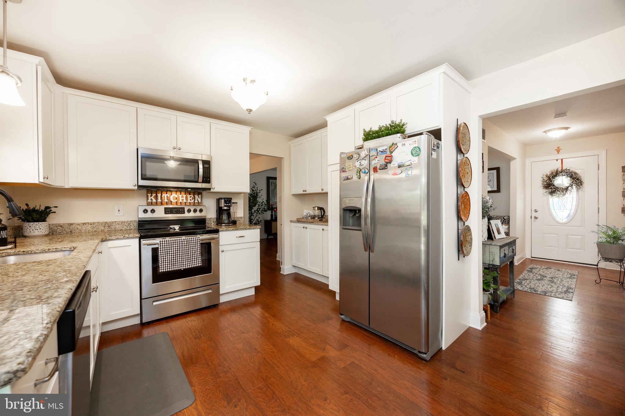926 Pierce Road Norristown, PA 19403 - Photo 15 of 54 a kitchen with stainless steel appliances a refrigerator a stove top oven a sink and dishwasher