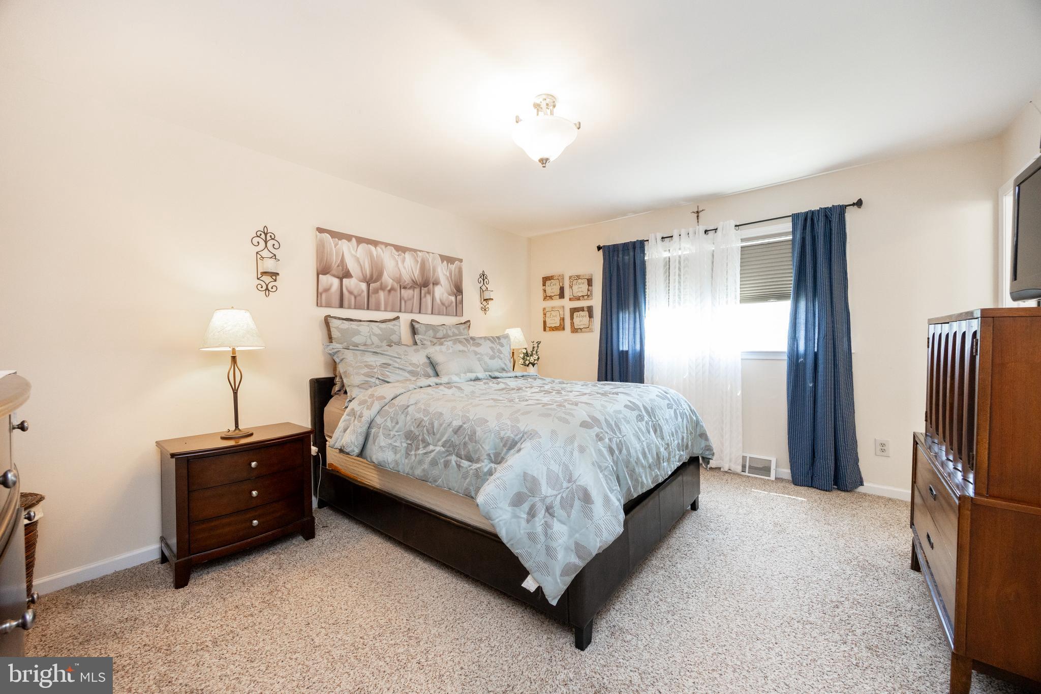 926 Pierce Road Norristown, PA 19403 - Photo 24 of 54 a spacious bedroom with a bed and a walk in closet