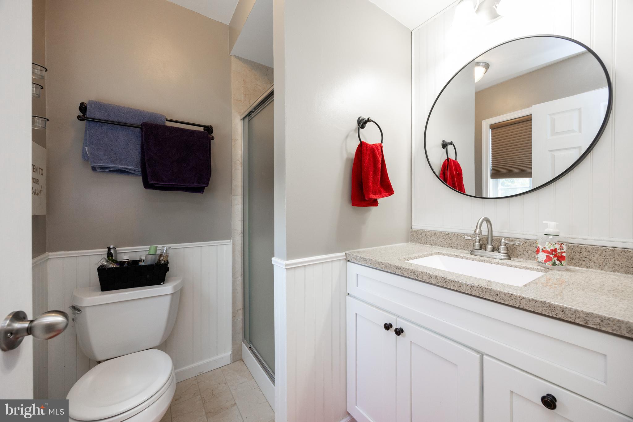 926 Pierce Road Norristown, PA 19403 - Photo 26 of 54 a bathroom with a toilet a sink and a mirror
