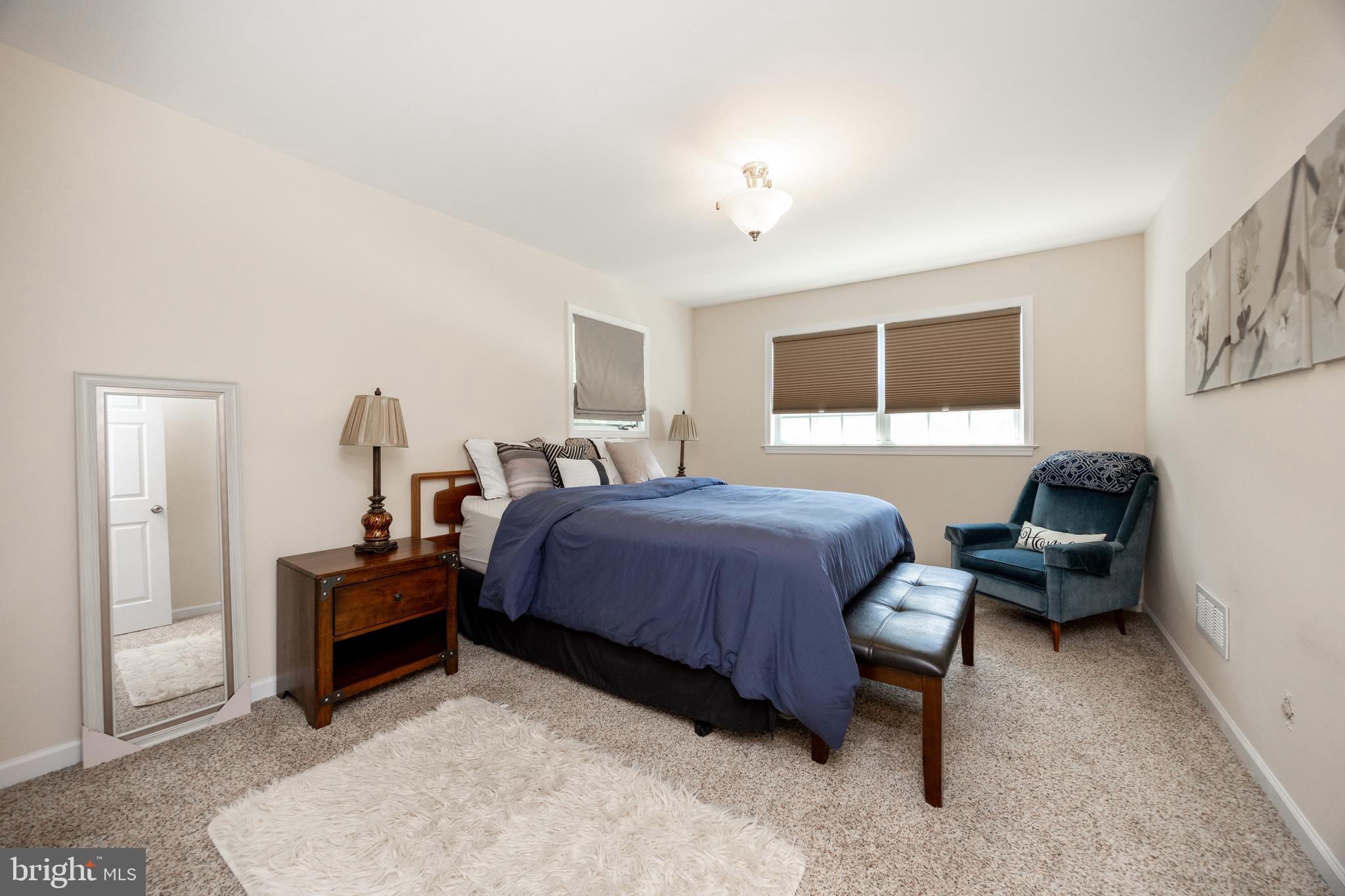 926 Pierce Road Norristown, PA 19403 - Photo 28 of 54 a bedroom with furniture and a flat screen tv