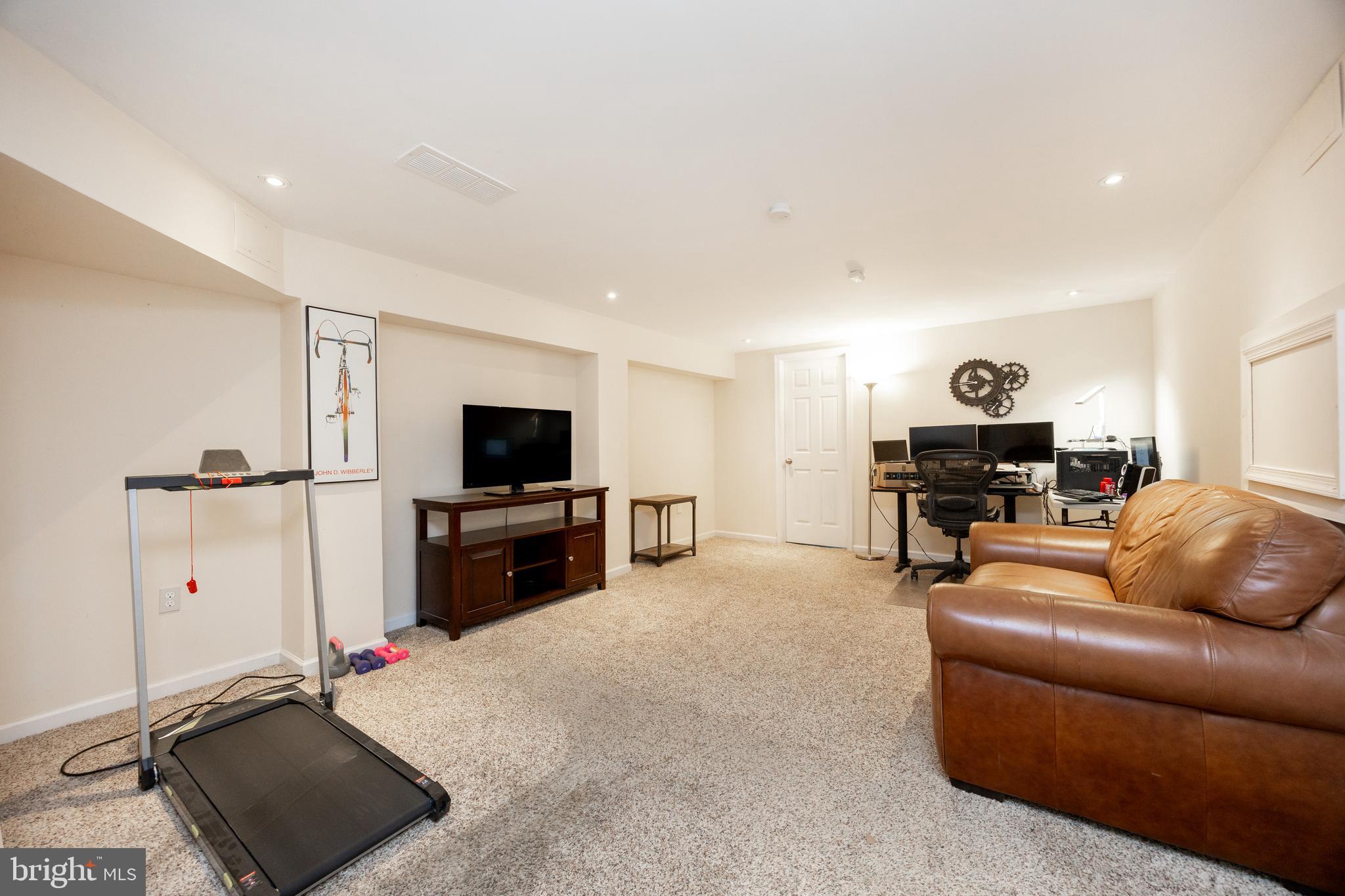 926 Pierce Road Norristown, PA 19403 - Photo 31 of 54 a living room with furniture and a flat screen tv
