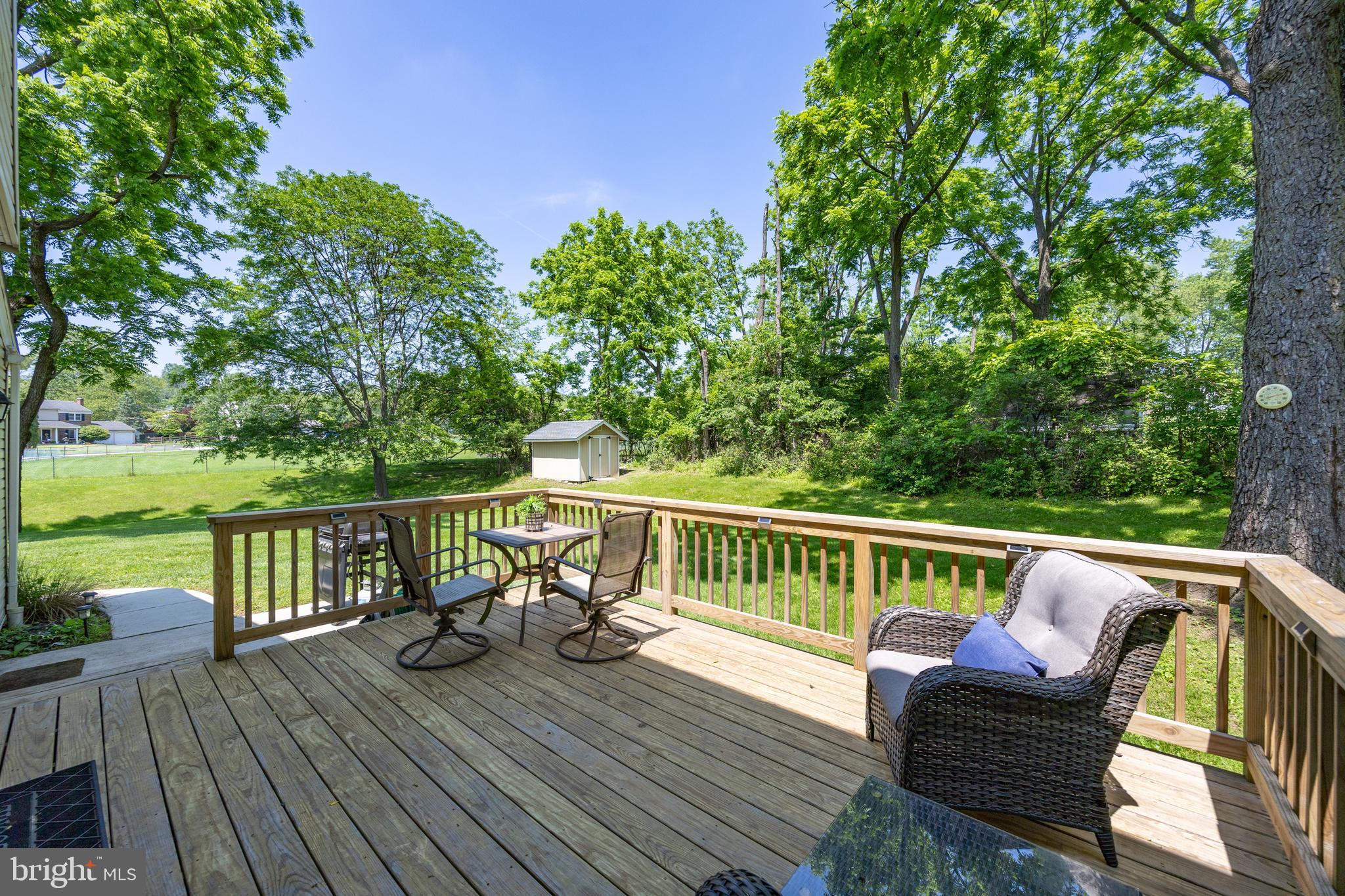 926 Pierce Road Norristown, PA 19403 - Photo 33 of 54 a view of a deck with chairs a barbeque with wooden floor and fence