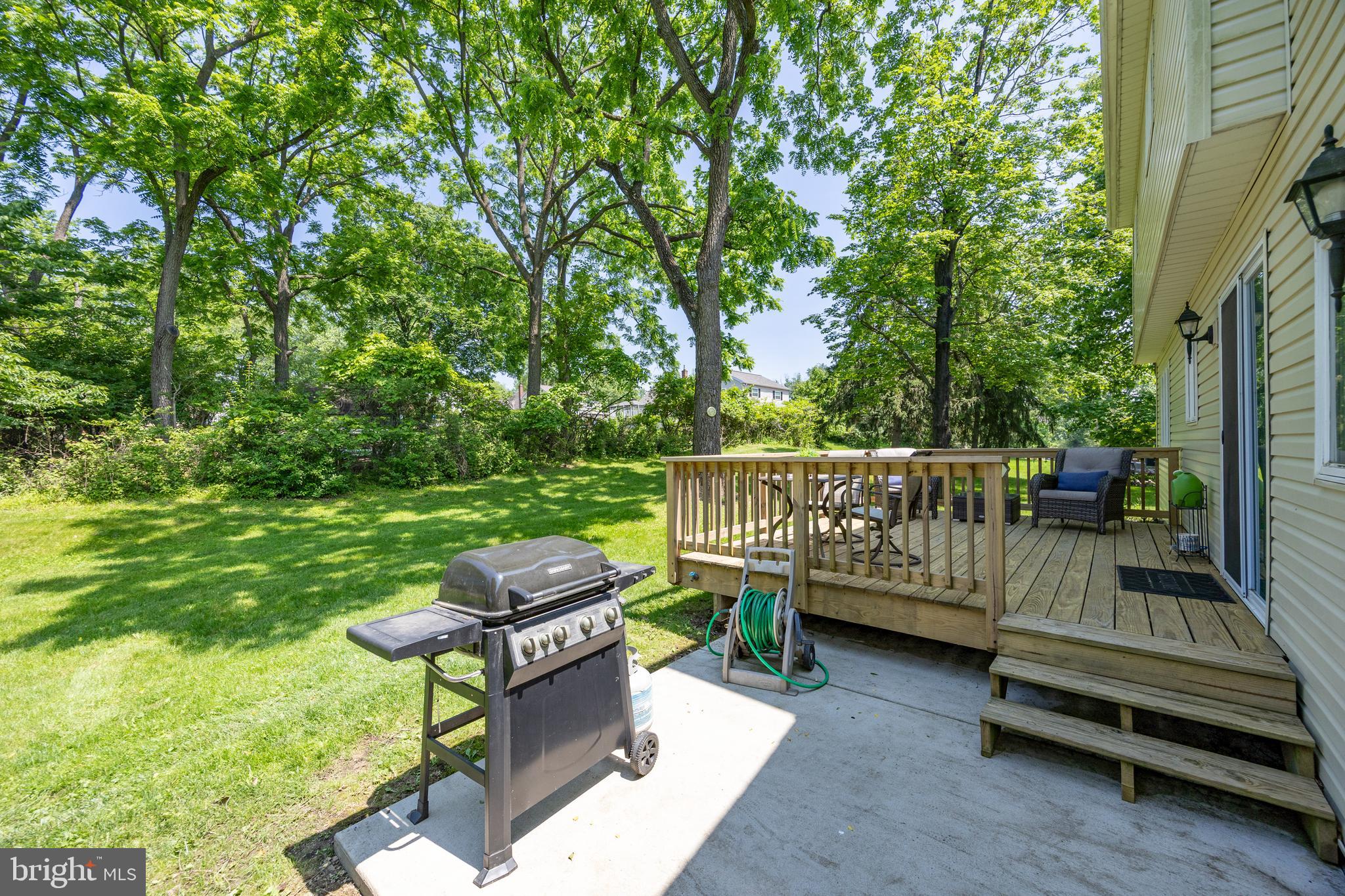 926 Pierce Road Norristown, PA 19403 - Photo 35 of 54 a view of a wooden deck with a bench and a yard