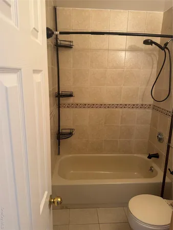 a bathroom with a shower and a toilet