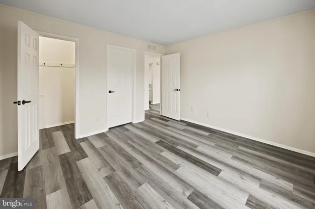 a bathroom with a sink toilet and mirror