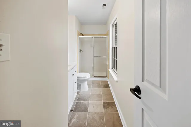 a view of room with wooden floor