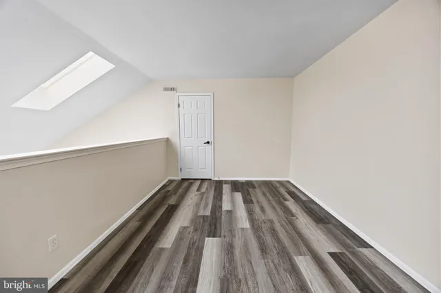 a view of a hallway with stairs